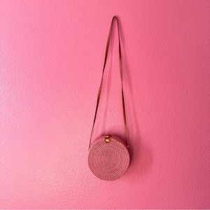 Round Pink Rattan purse.